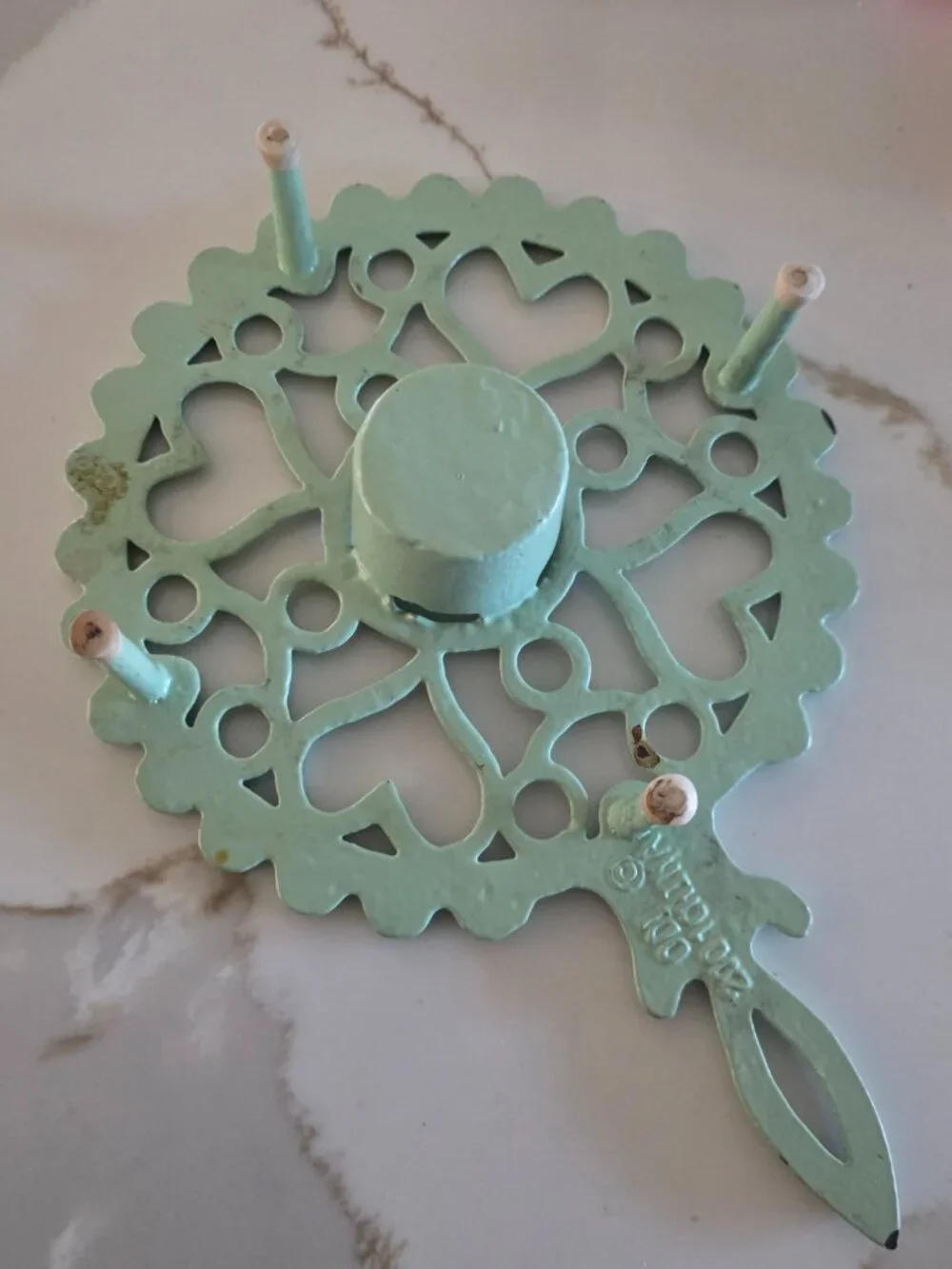 LT GREEN ENAMELED CAST IRON TEAPOT WARMER  TRIVET, (CANDLE HOLDER AT THE CENTER)
